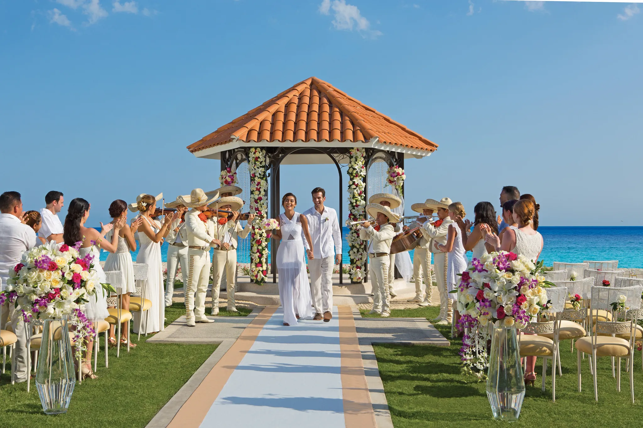 Beachfront gazebo wedding ceremony with mariachi band at Dreams Los Cabos Suites Golf Resort & Spa