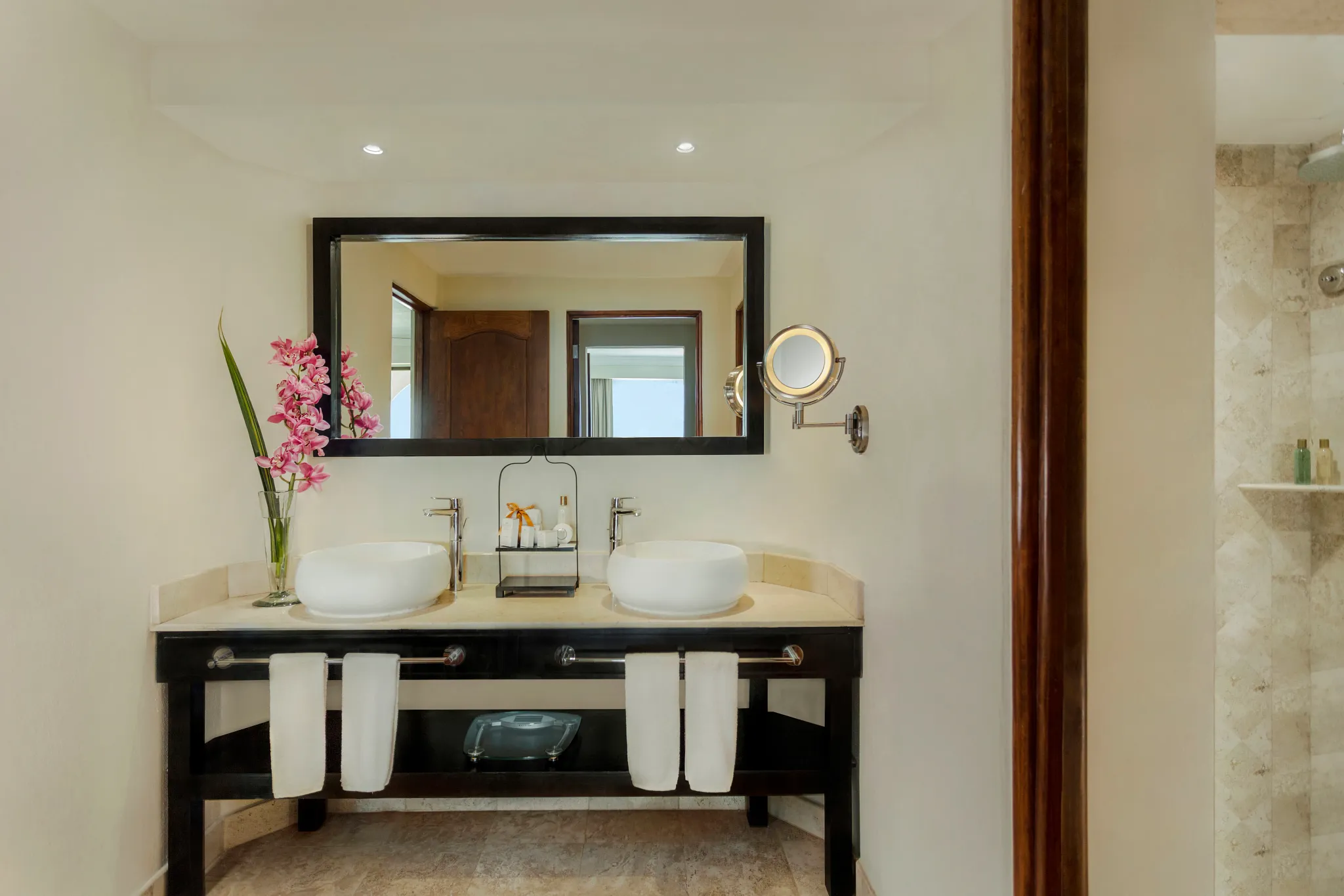 One Bedroom Suite Ocean View bathroom with dual vanities and marble finishes at Dreams Los Cabos Suites Golf Resort & Spa.