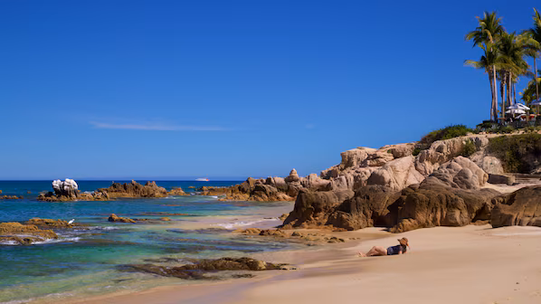 Palmilla Beach with clear turquoise waters near Dreams Los Cabos Suites Golf Resort & Spa in San José del Cabo